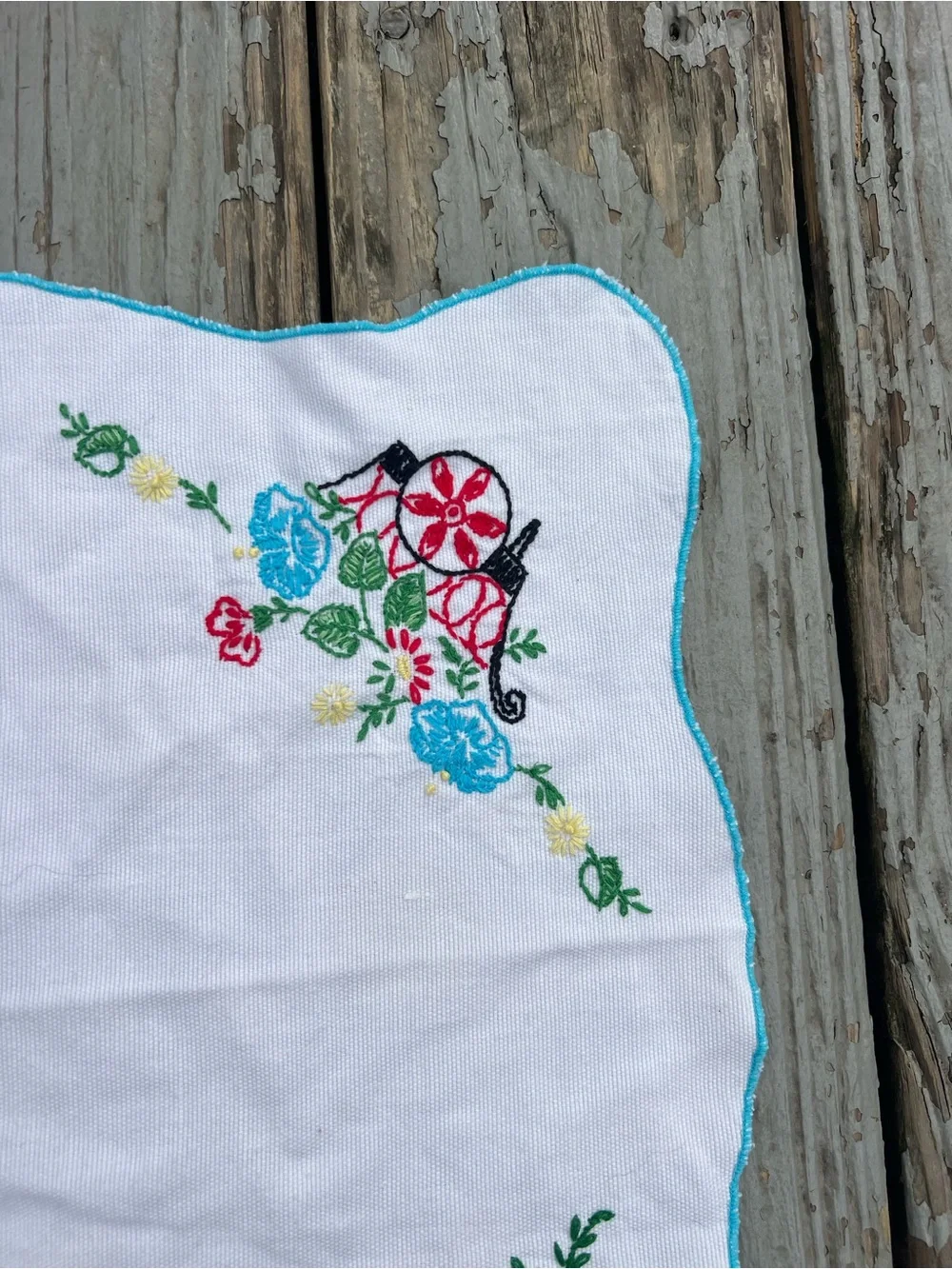 Vintage White Embroidered Table Linen with Blue and Red Floral Accents